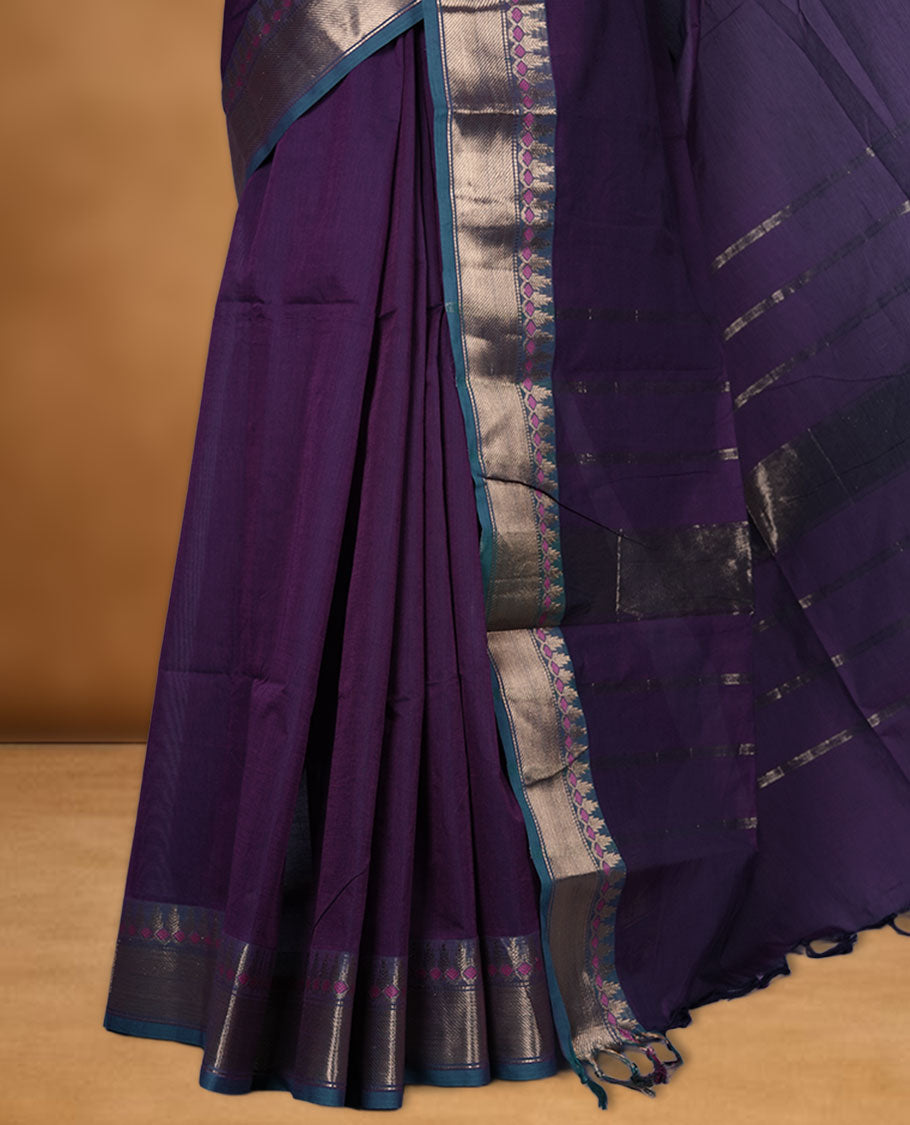 Purple colour chettinad cotton saree featuring Elegant plain body, contrast green colour border with gold zari border, pallu and paired with matching blouse.