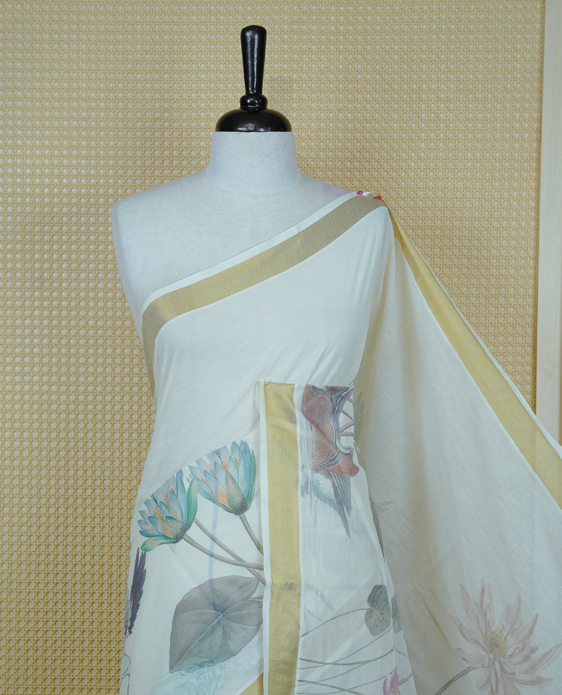 Cream colour Cotton kerala Saree featuring Flower & Bird Print on body, Enhancing Gold zari kasavu border, comes with matching blouse piece.