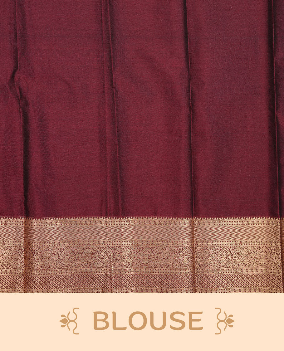 Brown colour soft silk saree featuring Gold zari dotted stripes & motifs on body, complemented by self colour with traditional border, paired with matching blouse piece.