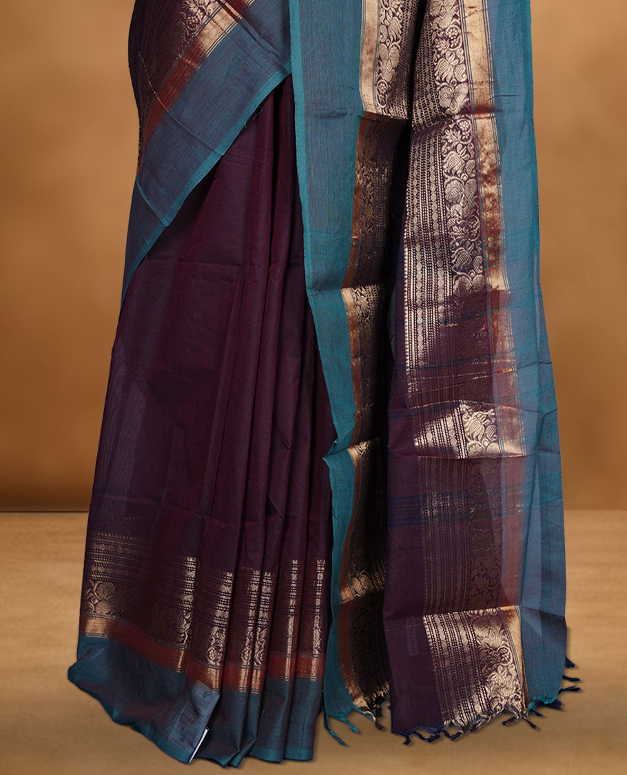 Wine colour chettinad cotton saree featuring plain body, with matching traditional gold zari border paired with matching blouse.