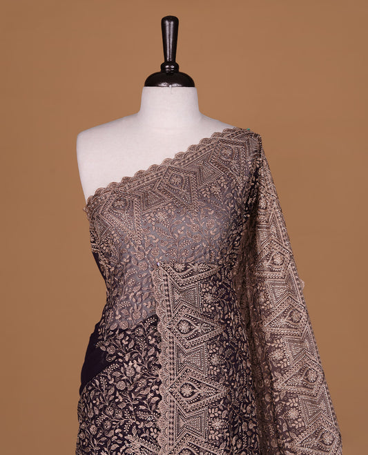 Deep purple colour georgette designer saree featuring Gold thread floral pattern on body highlighting with stone and scalp border, paired with matching blouse piece.