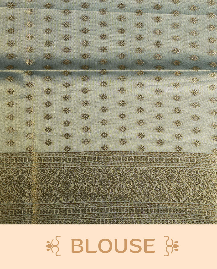 Dual tone teal and gold colour tissue brocade saree featuring antique gold zari motifs on the body with a rich traditional zari border and pallu, paired with a matching blouse piece.