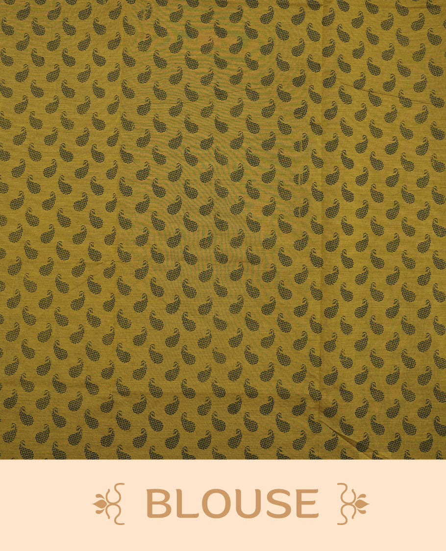 Dark Mustard colour poly cotton saree with black floral butti motifs on the body, paired with a matching pallu featuring black ornate floral jaal and stripes on the border, and a coordinated all‑over black paisley printed blouse piece.