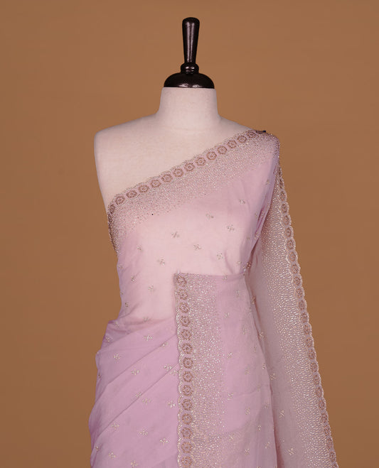 Lavender colour designer saree featuring gold & white stone worked body and border, paired with matching blouse piece.