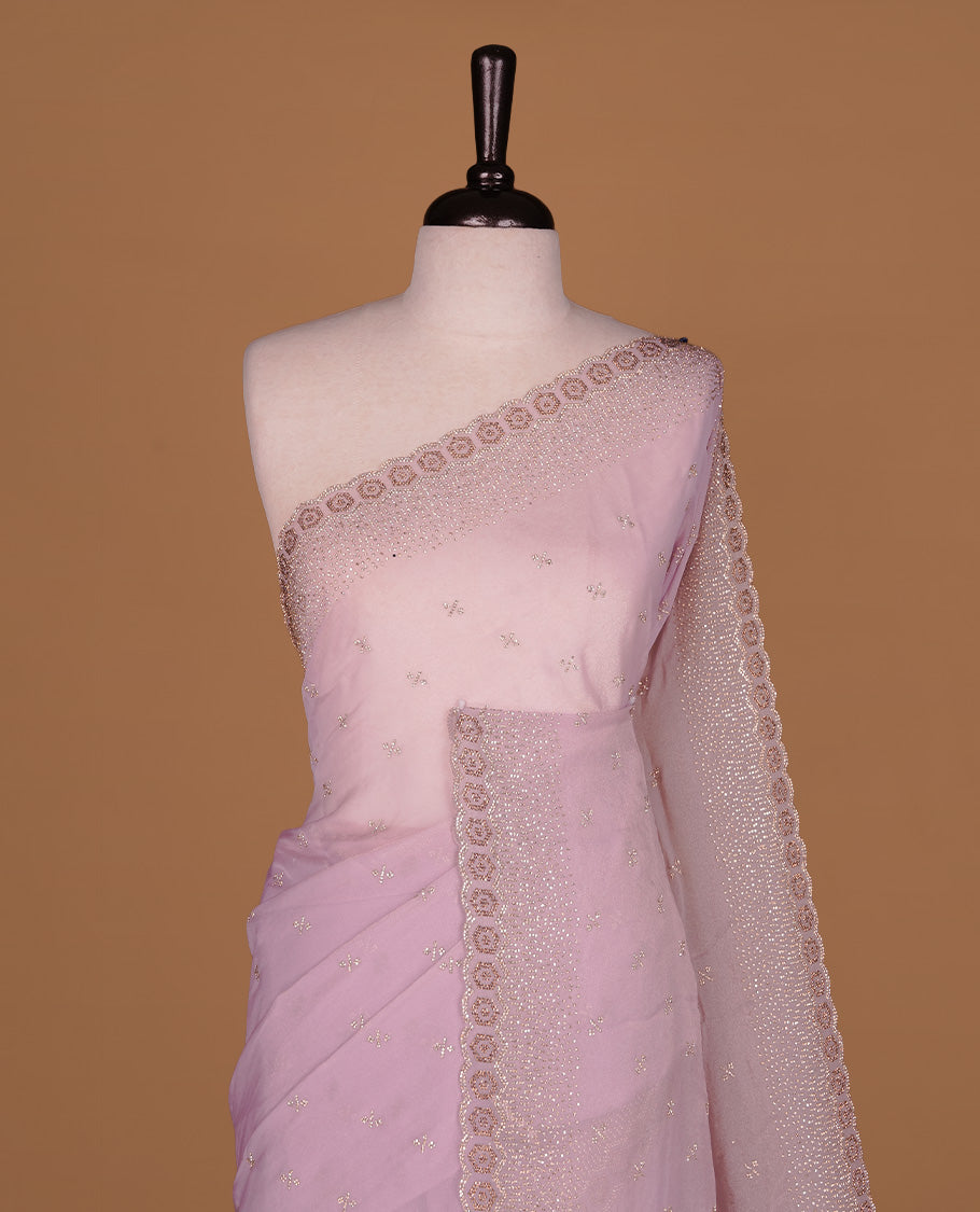 Lavender colour designer saree featuring gold & white stone worked body and border, paired with matching blouse piece.