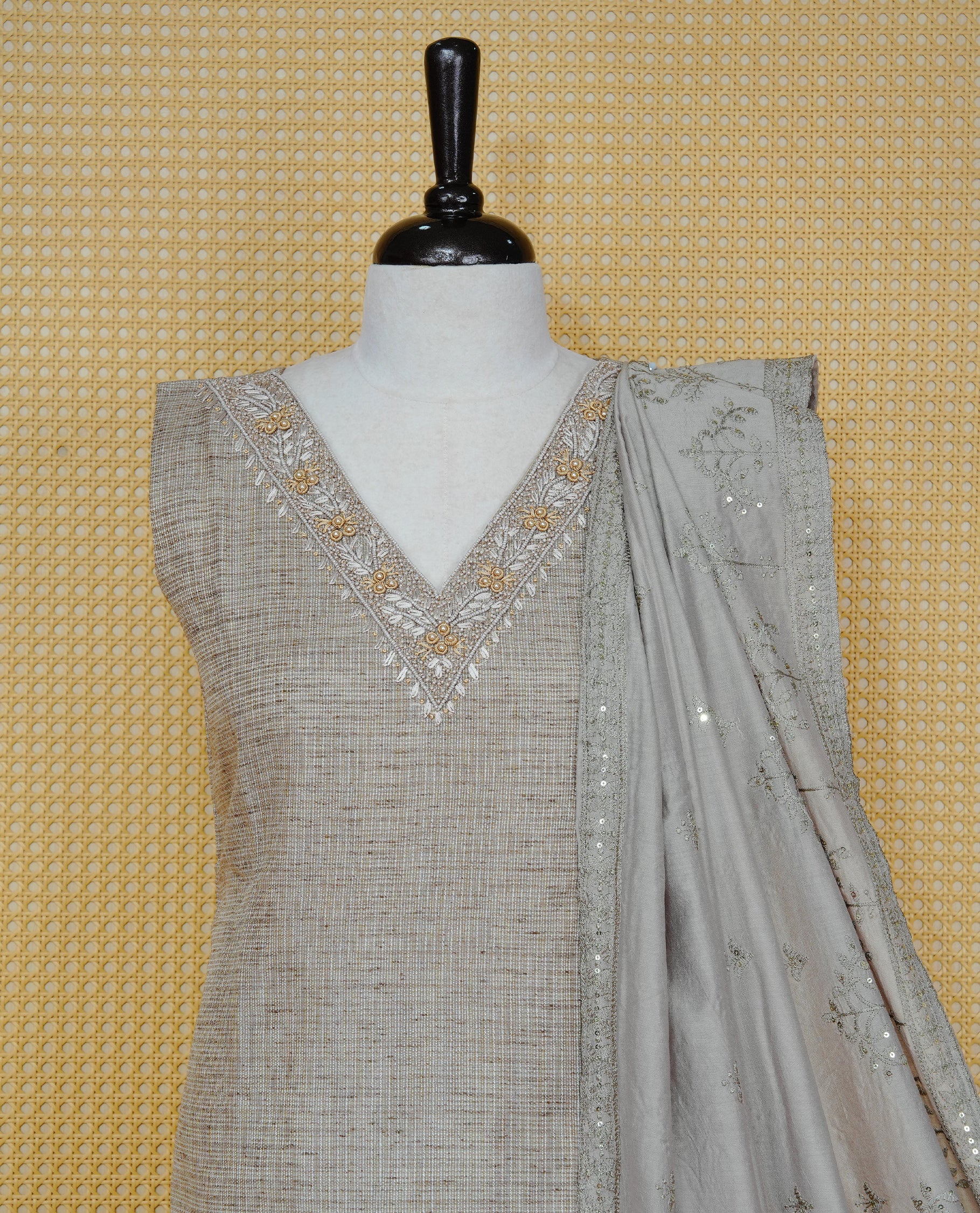 Tan Beige colour Tissue Churidar Set featuring delicate embroidery and subtle bead detailing on the yoke, paired with matching solid pants and dupatta.