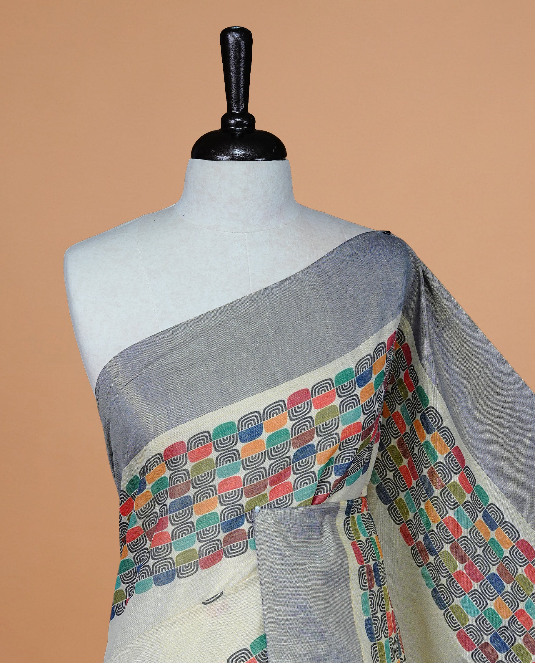 Cream colour Tissue kerala saree featuring Classy Multi colour Box pattern on body, Styled by blue & gold zari border and pallu, comes with matching blouse piece.