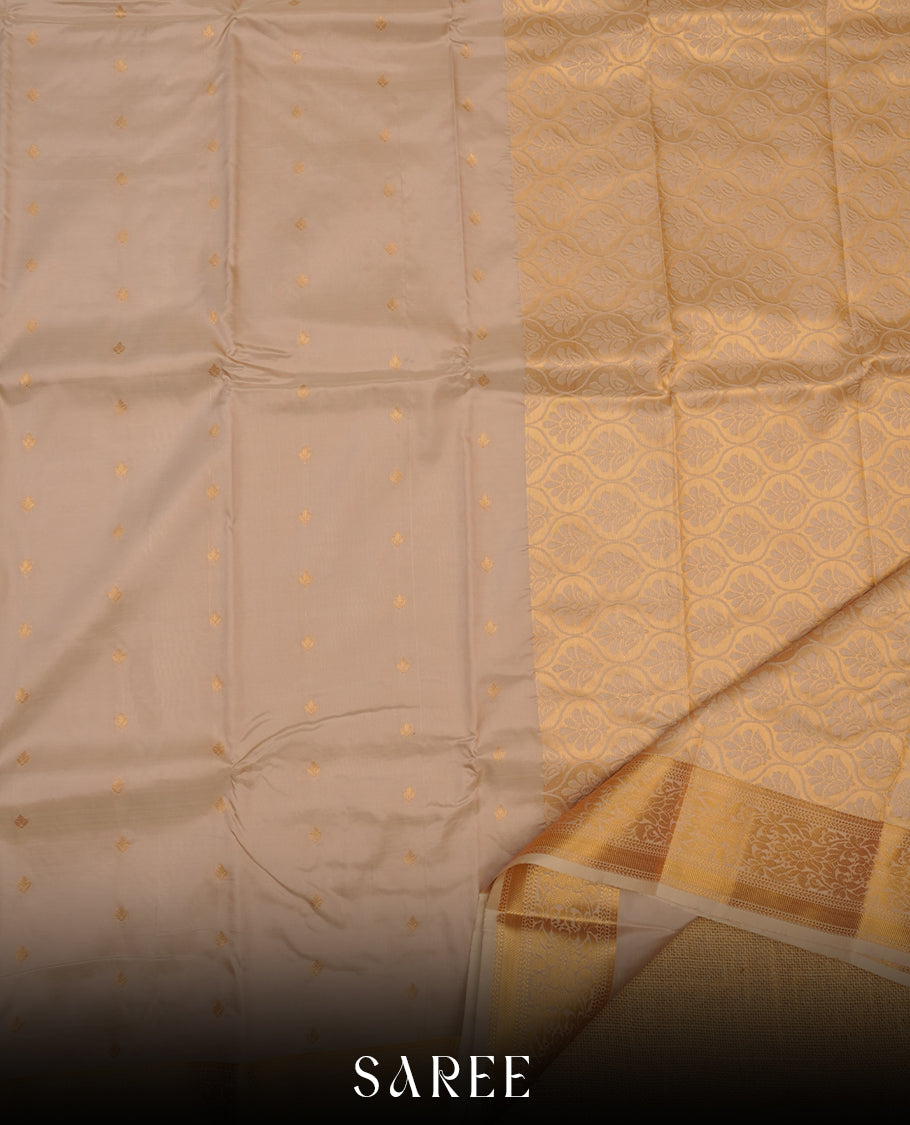 Sandstone colour shirt and dhoti with gold colour border, paired with matching colour silk saree featuring gold zari buttas and traditional border paired with matching blouse piece.