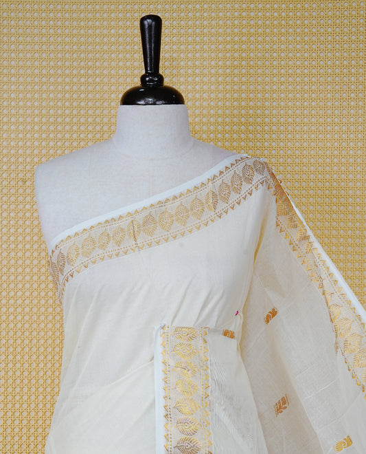 Cream Colour Cotton Kerala Saree Featuring Gold Buttas on the Body, a Classy Gold Zari Border, and a Traditional Red Colour Lord Krishna Thread work and Gold Zari Pallu, Paired with a Matching Blouse Piece.
