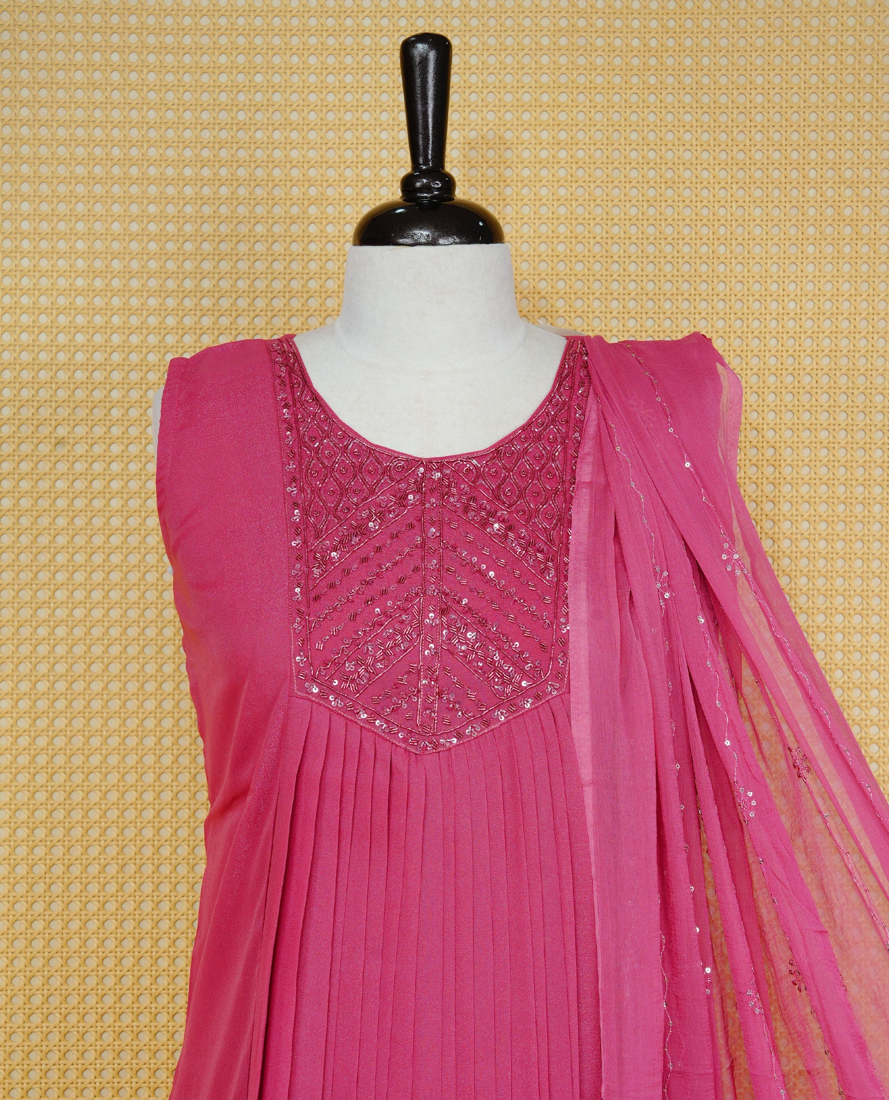 Mauve pink colour pleated churidar set featuring intricate bead and sequin embroidery on the yoke, paired with matching solid pants and dupatta.