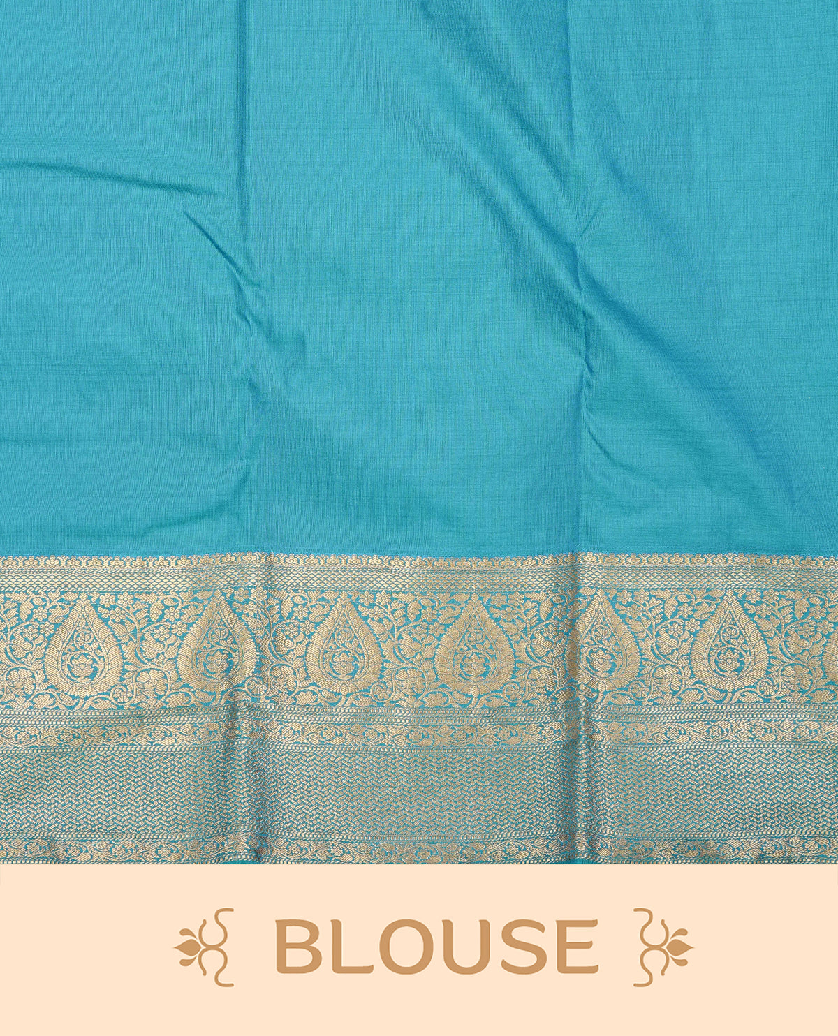 Blue colour semi wedding saree featuring light gold zari wave pattern motifs across the body, complemented by contrast self colour traditional border. Comes with a matching blouse piece.