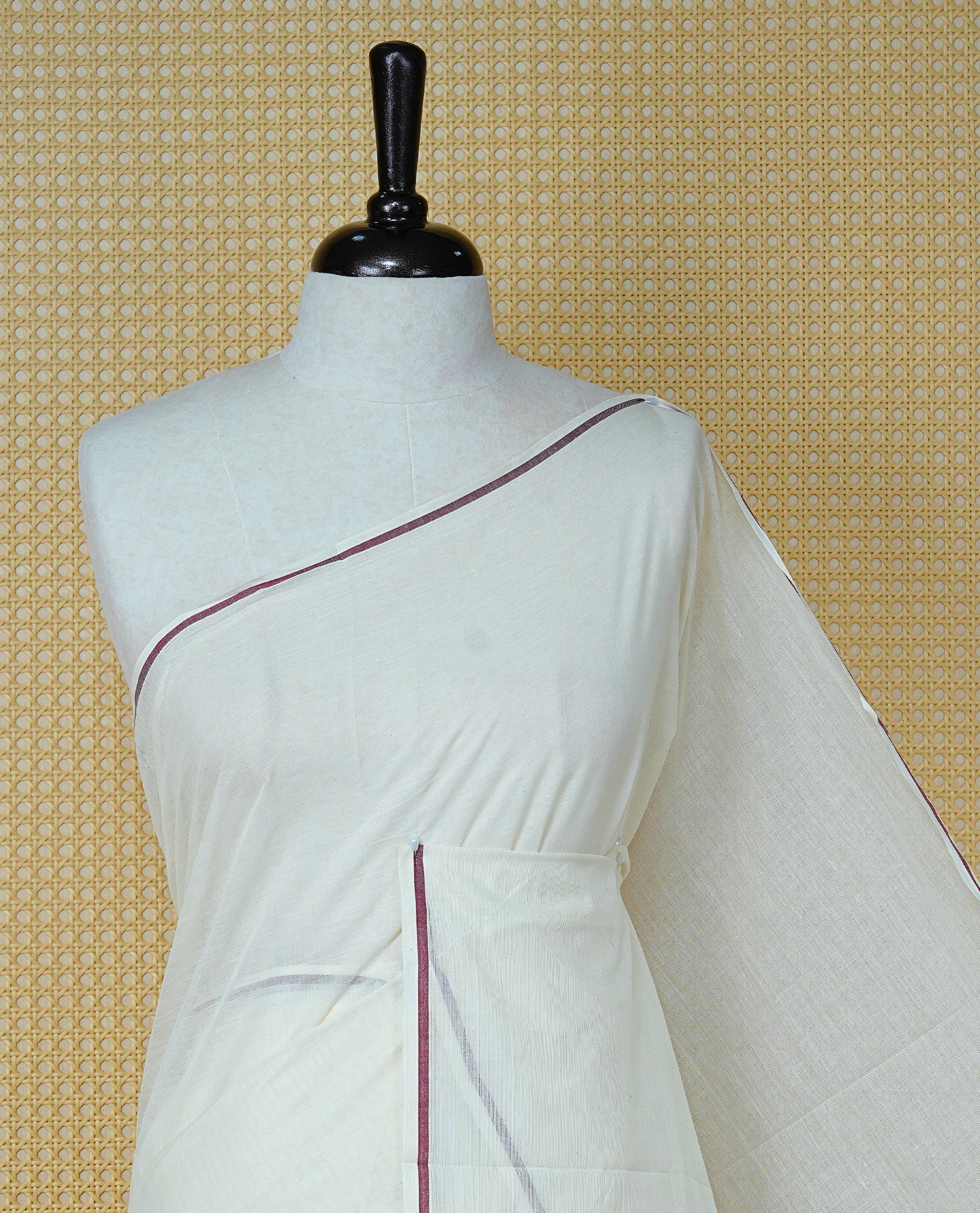 Cream Colour Cotton Kerala Saree Featuring A Classy Plain Body For Effortless Elegance, Enhanced By A Minimalist Maroon Border, Paired With A Matching Blouse Piece.