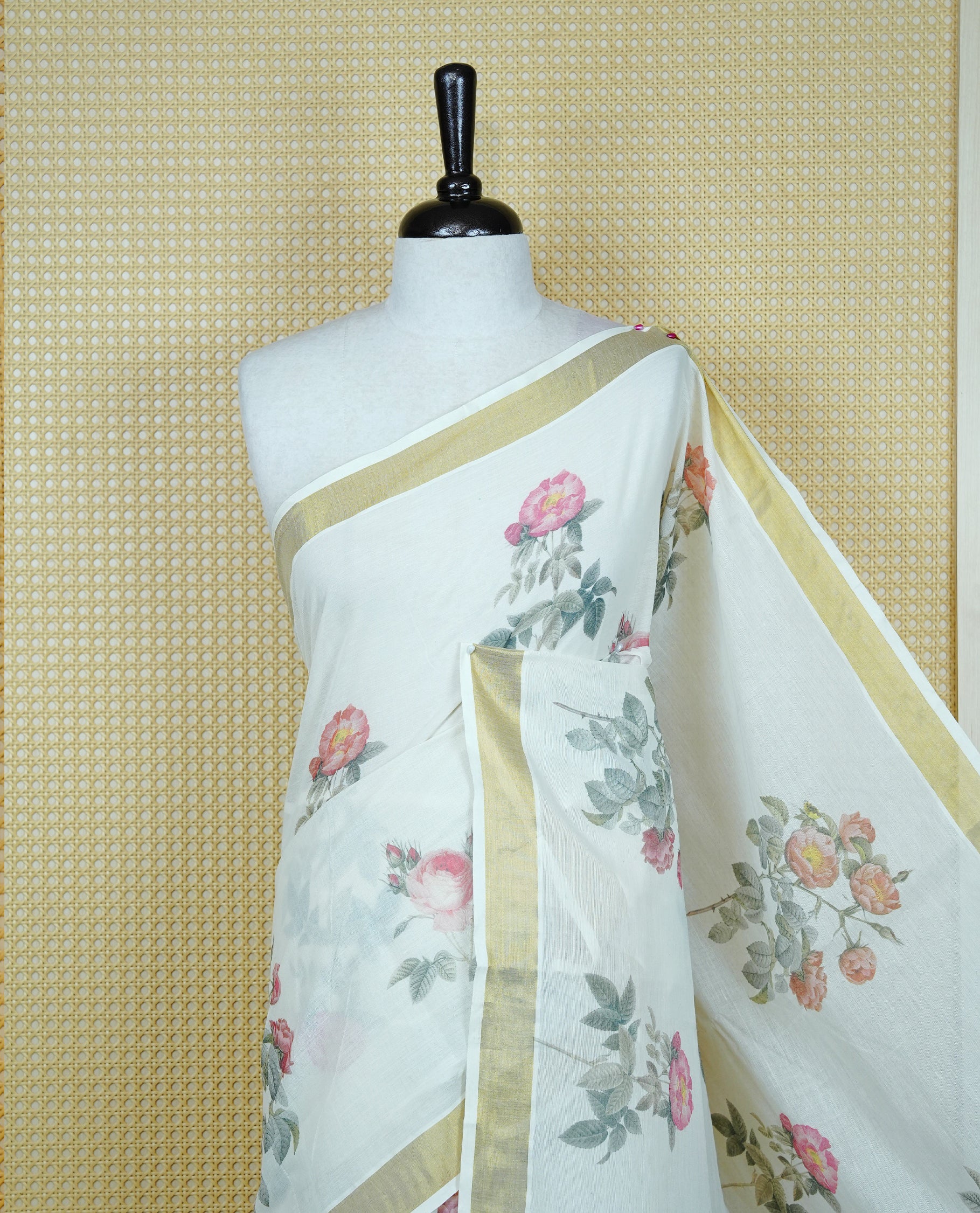 Cream colour Cotton kerala Saree featuring Flower Print on body, Enhancing Gold zari kasavu border, comes with matching blouse piece.