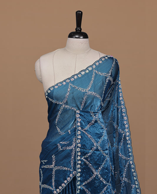 Blue colour designer saree featuring Sequins & cut beats worked body, cut beat worked border, paired with matching unstitched blouse.
