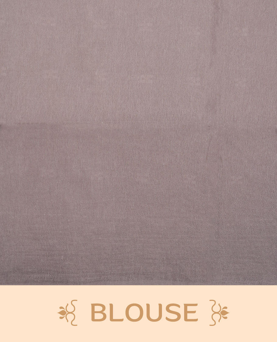 Gray colour semi jute saree highlighting white thread motifs on body, without border and paired with matching blouse.