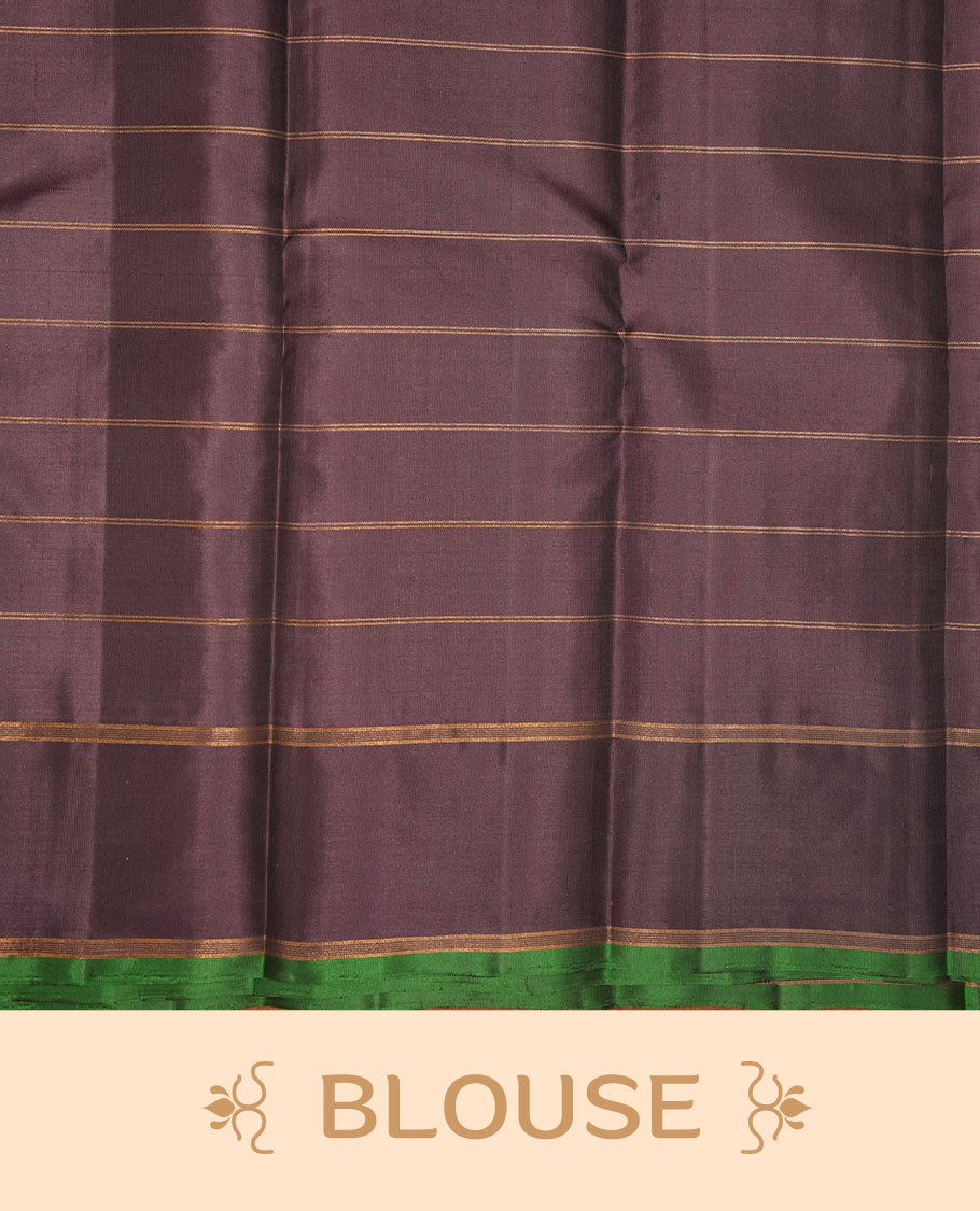 Burgundy colour soft silk saree featuring elegant gold zari check across the body, complemented by a contrast deep purple with green piping on border, and paired with a matching blouse piece.