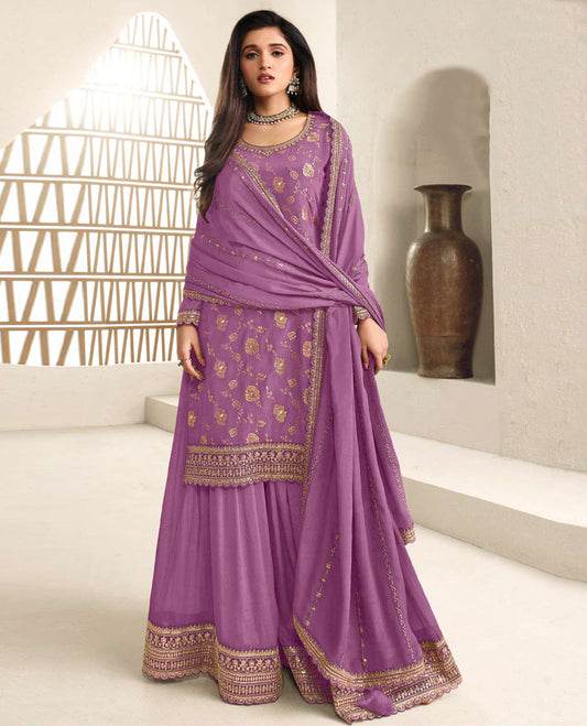 Lavender colour semi stitched salwar suit featuring an embroidered chinon top material paired with a matching sharara  bottom, and dupatta.