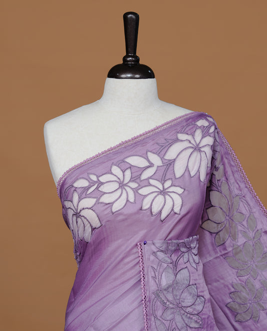 Pastel Purple colour Designer saree Featuring Elegant plain body, enhance with thread Lotus Pattern with lace border, paired with matching blouse piece.