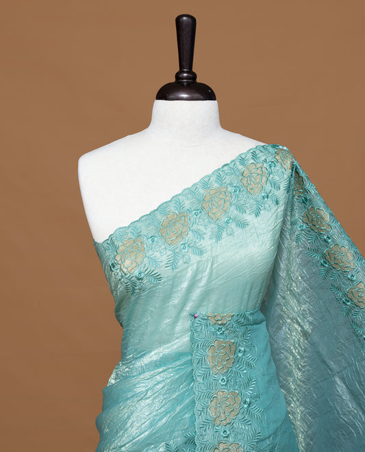 Aqua colour Crush Organza Featuring Plain body, Enrich with Floral thread pattern & scalp border, paired with matching blouse piece.