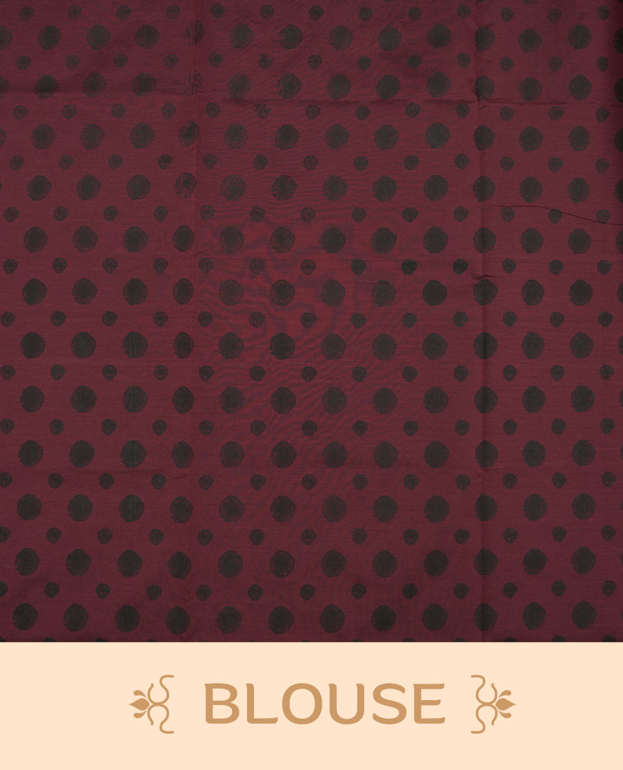 Dark maroon colour poly cotton saree with black abstract butti motifs on the body, paired with a matching pallu with dense black textured round butta pattern, and a coordinated all‑over textured round butta printed blouse piece.