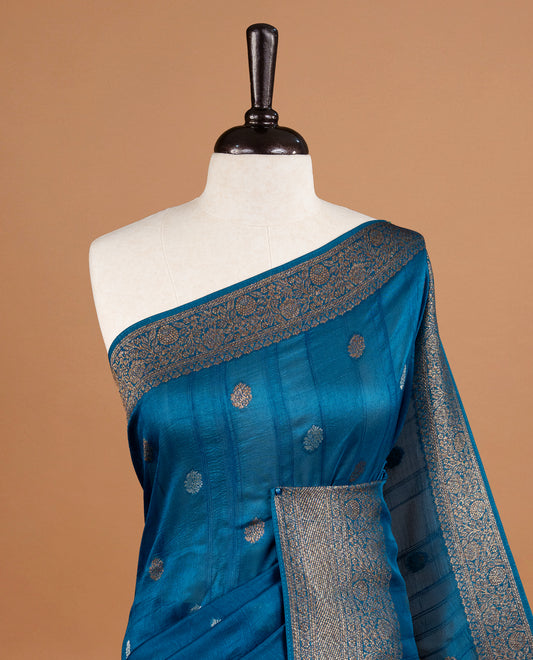 Light aqua colour Semi banaras tussar georgette Saree featuring Antique zari motifs on body, enhanced with antique zari border, paired with a matching blouse piece.