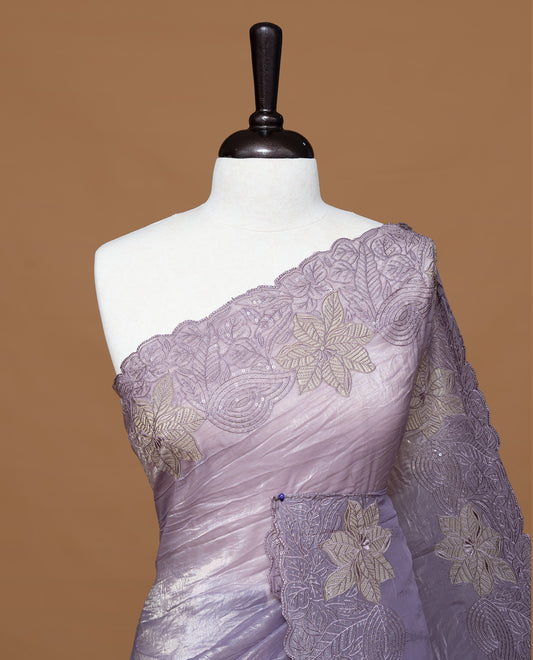 Pastel Purple colour Crush Organza Featuring Plain body, Enrich with Floral thread pattern with sequins & scalp border, paired with matching blouse piece.