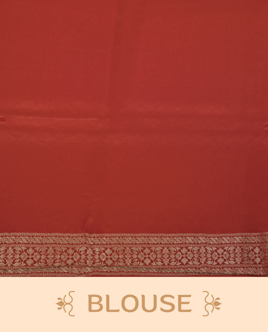 Red colour banaras satin crepe saree featuring gold zari pattern across body, with self colour border with gold zari pattern and paired with matching blouse.