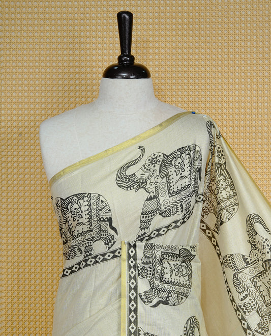 Cream colour Tissue kerala saree featuring Elegant plain body, complemented by Elephant print border, comes with matching blouse piece.