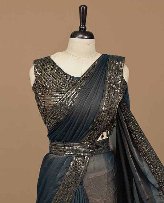 Gold & blue double shade designer saree features Elegant plain body, highlights Sequins & cut beats on border, paired with ready made blouse.