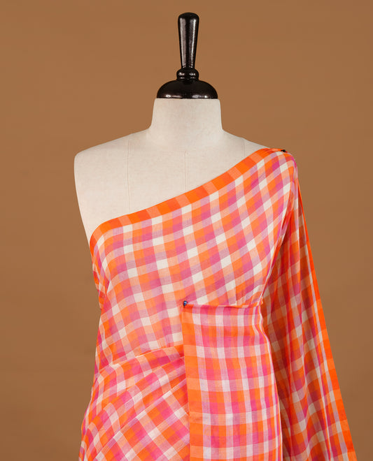 Orange, Pink and White colour Mul Cotton saree featuring a classic Big check pattern on the body, accented with tassels for added charm. Comes without a blouse piece.