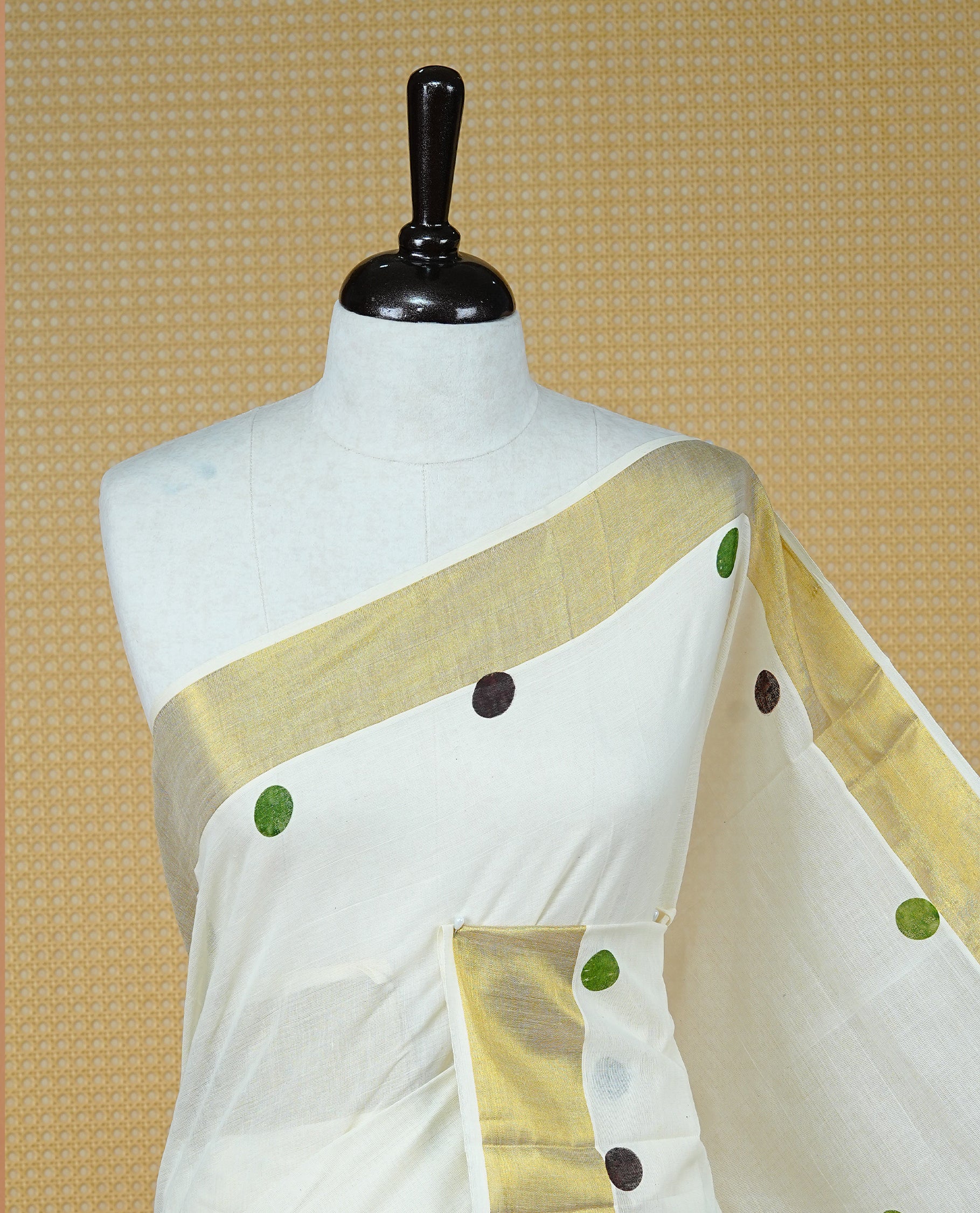 Cream Colour Kerala Saree Featuring Multicolour Dot Prints On The Body, Complemented By A Traditional Gold Zari Border, Paired With A Matching Blouse Piece.
