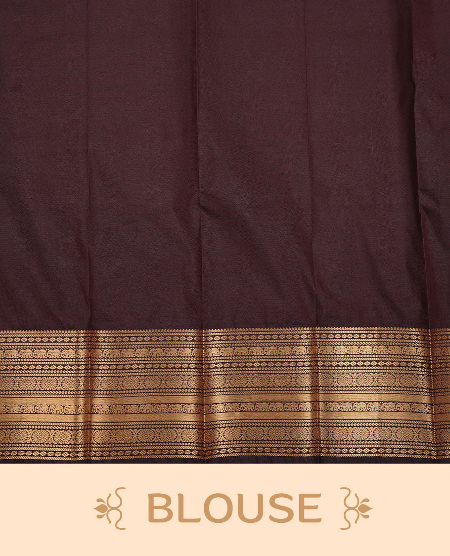 Chocolate colour soft silk saree featuring Gold zari motifs on body, complemented by self colour with traditional border, paired with matching blouse piece.