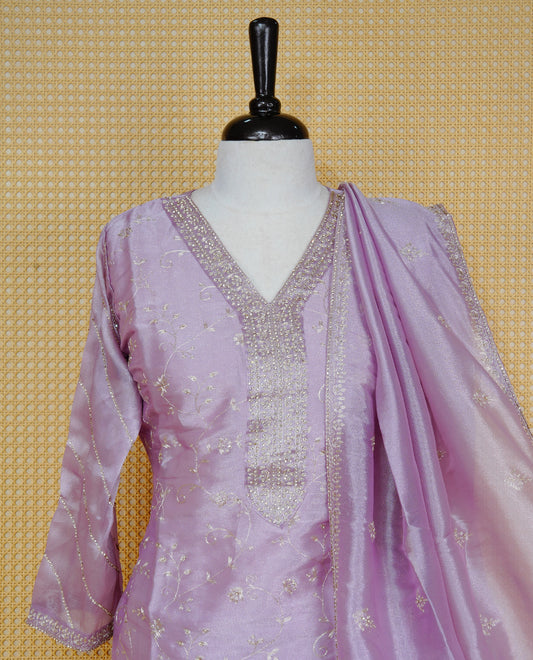 Lavender colour churidar set with delicate thread and sequin floral embroidery, an embellished V-neckline, paired with a matching embroidered dupatta and solid pants.