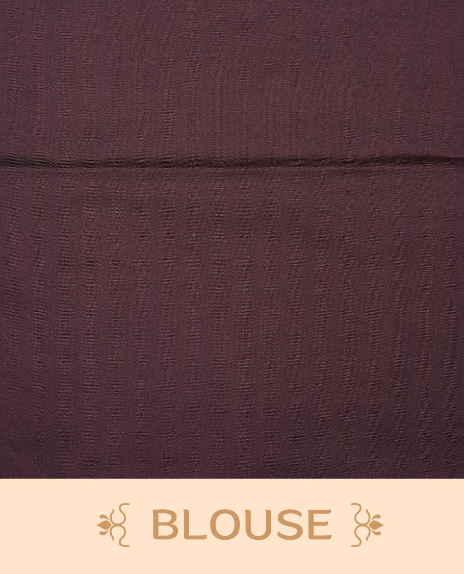 Olive colour soft silk saree features a sleek borderless design with intricate antique zari motifs, flowing into a striking contrast deep purple pallu and a matching blouse piece.