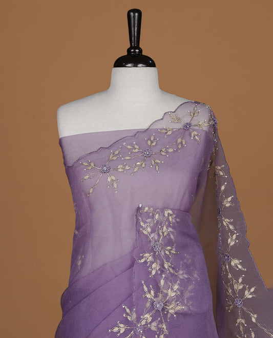 Pastel purple colour crush organza saree featuring gold thread floral and stone worked body, highlighting scalp designed border, paired with matching blouse piece.