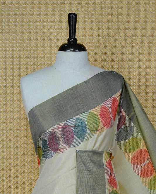 Cream Colour Tissue Kerala Saree Featuring Multicolour Circular Prints Along The Border And Pallu, Complemented By A Black Border With Traditional Gold Zari Accents, Paired With A Matching Blouse Piece.
