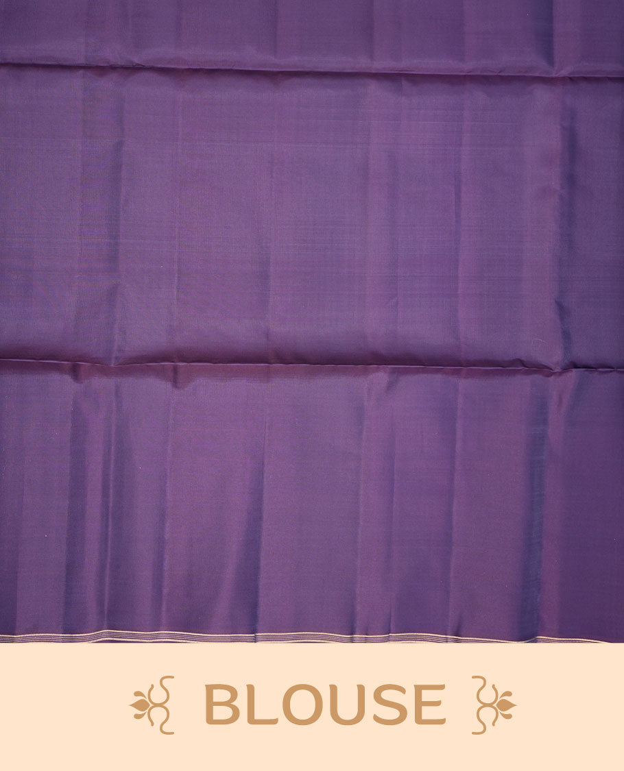 Indigo colour soft silk saree featuring gold zari motifs on body, complemented by self colour with traditional border with tassel at pallu, paired with matching blouse piece.