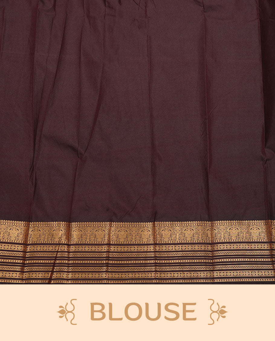 Chocolate colour soft silk saree featuring Gold zari motifs on body, complemented by self colour with traditional border, paired with matching blouse piece.