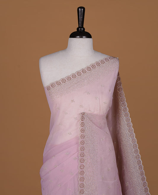 Pink colour designer saree featuring gold & white stone worked body and border, paired with matching blouse piece.
