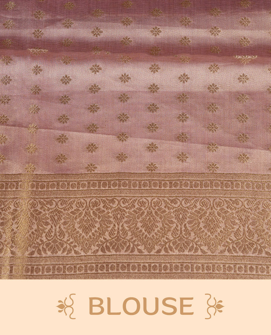 Dual tone light peach and pink colour tissue brocade saree featuring antique gold zari motifs on the body with a rich traditional zari border and pallu, paired with a matching blouse piece.