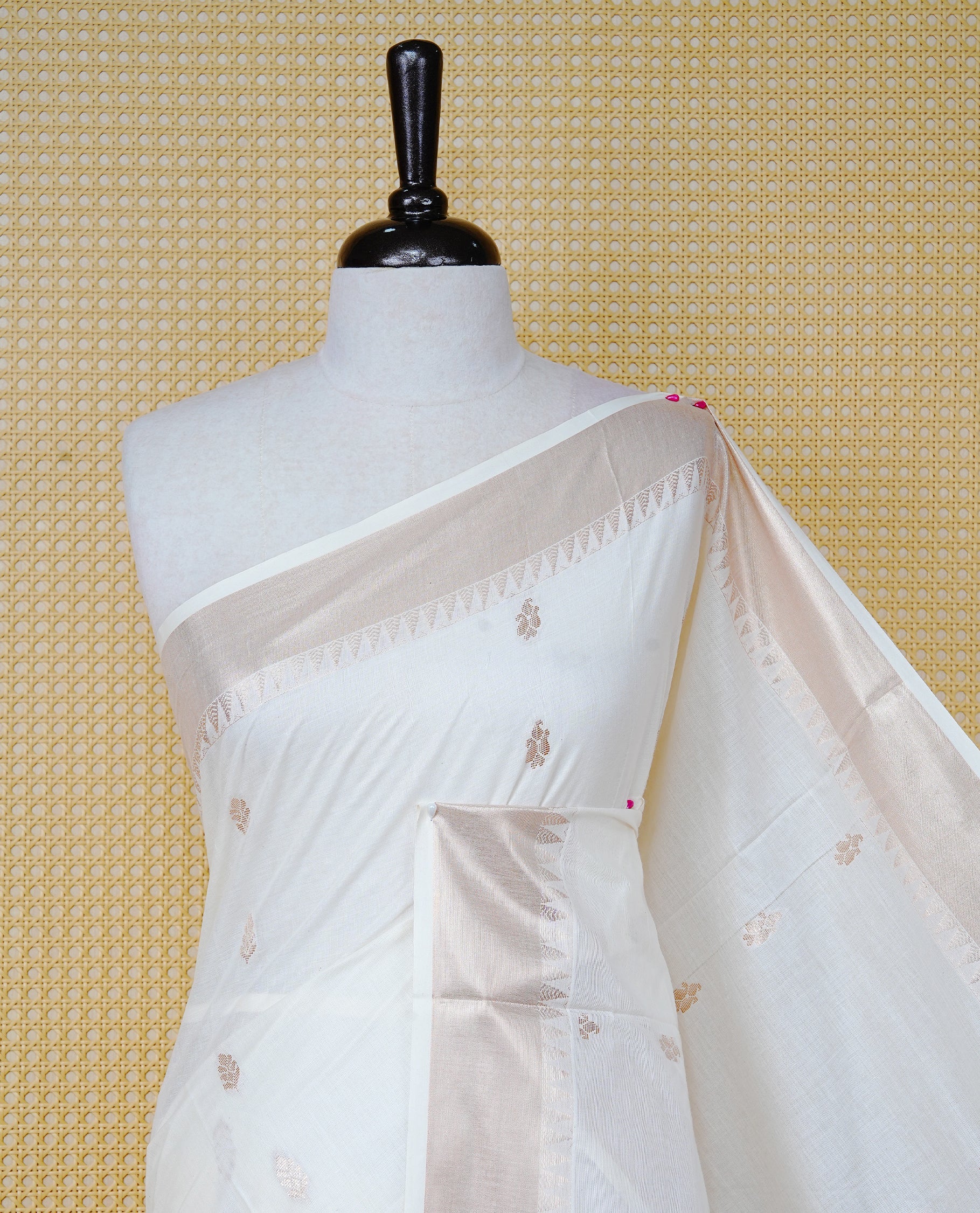 Cream Cotton Kerala Saree with  Gold Zari Leaf Motifs,  Gold Zari Leaf Pattern Border and Pallu, Paired with a Matching Blouse Piece.