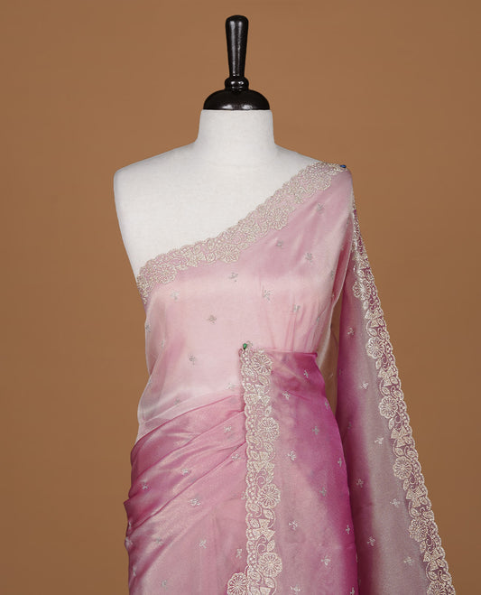 Pinkish purple colour designer saree featuring stone worked body, stone worked border, paired with matching blouse piece.
