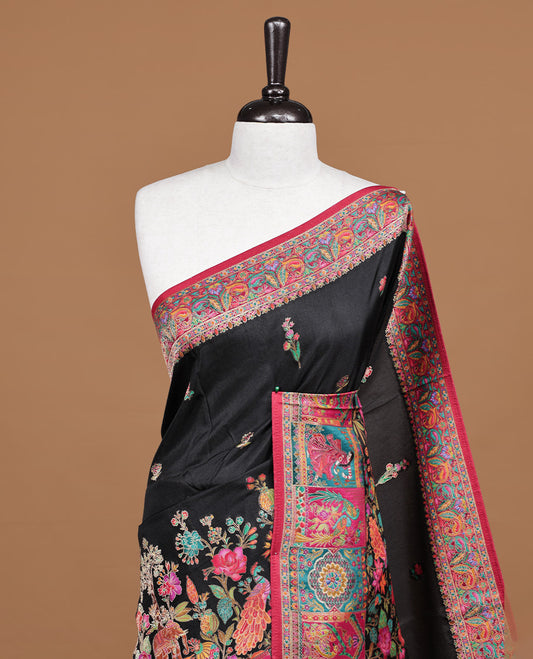 Black Pashmina silk saree featuring floral Pattern body, complemented by red border with multi colour bird motifs, complete with matching blouse piece.