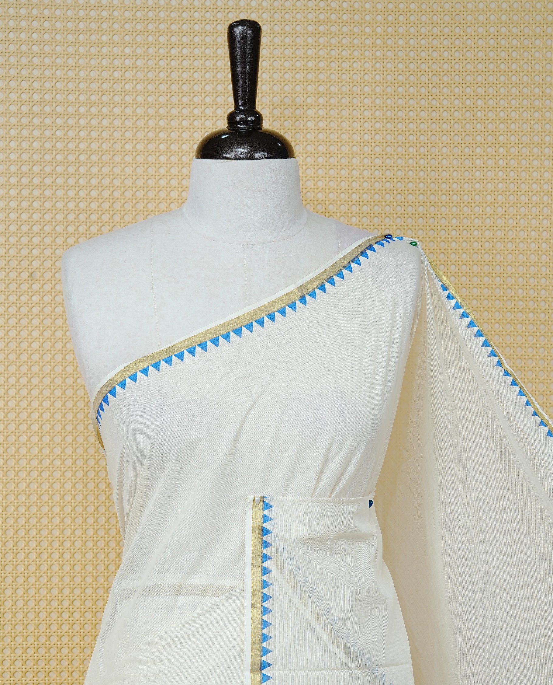 Cream Colour Cotton Kerala Saree Featuring A Gold Zari Border And Blue Temple Edging, Paired With A Matching Blouse Piece