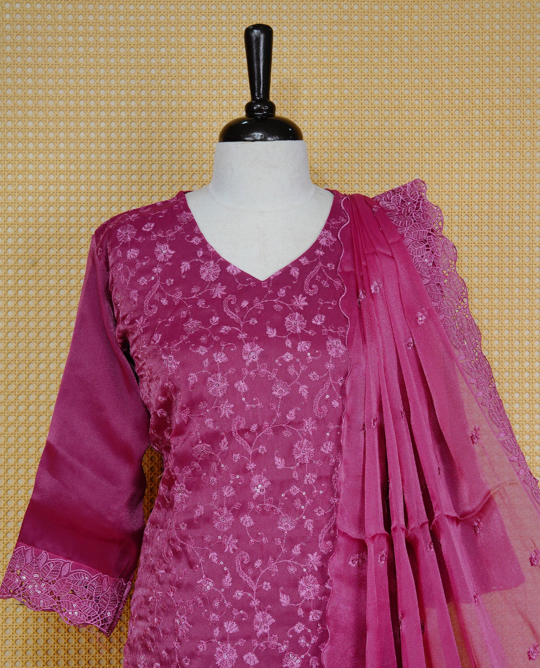 Dark Dusty Pink colour churidar set featuring delicate floral embroidery on the kurta, lace-trimmed sleeves and hem, paired with matching solid pants and an embellished sheer dupatta.