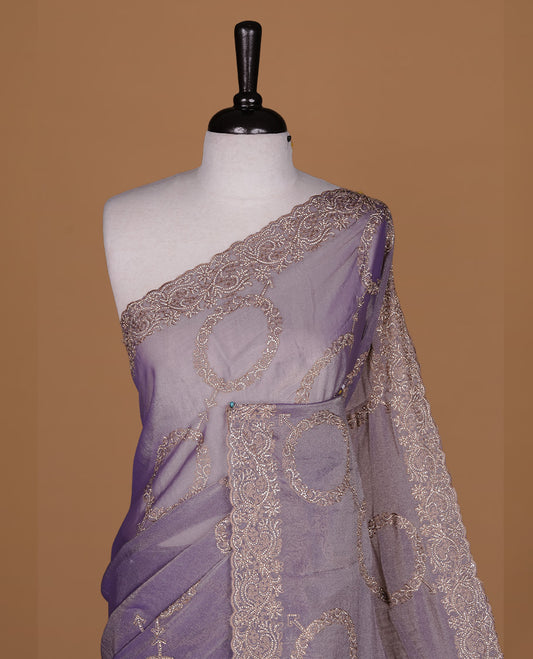 Lavender colour organza saree featuring thread & gold stone pattern on body, highlighting scalp border, paired with matching blouse piece.