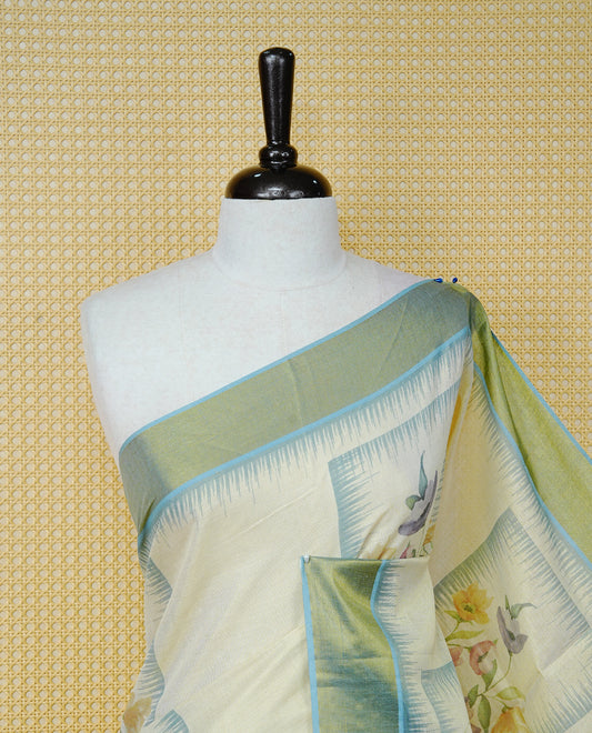 Cream Colour Tissue Kerala Saree Featuring Floral Prints in a Stylish Rectangle Pattern On Body, Enhanced with an Olive Green and Light Blue Zari Border, Multicoloured Striped Pallu Is Finished with Elegant Tassels and Paired with a Matching Blouse Piece.