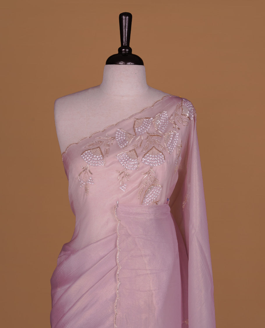 Pastel Pink colour net organza saree featuring thread, sequins, cut beats worked on body, highlighting scalp border, paired with matching blouse piece.