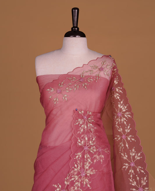 Mauve colour crush organza saree featuring gold threan floral and stone worked body, highlighting scalp designed border, paired with matching blouse piece.