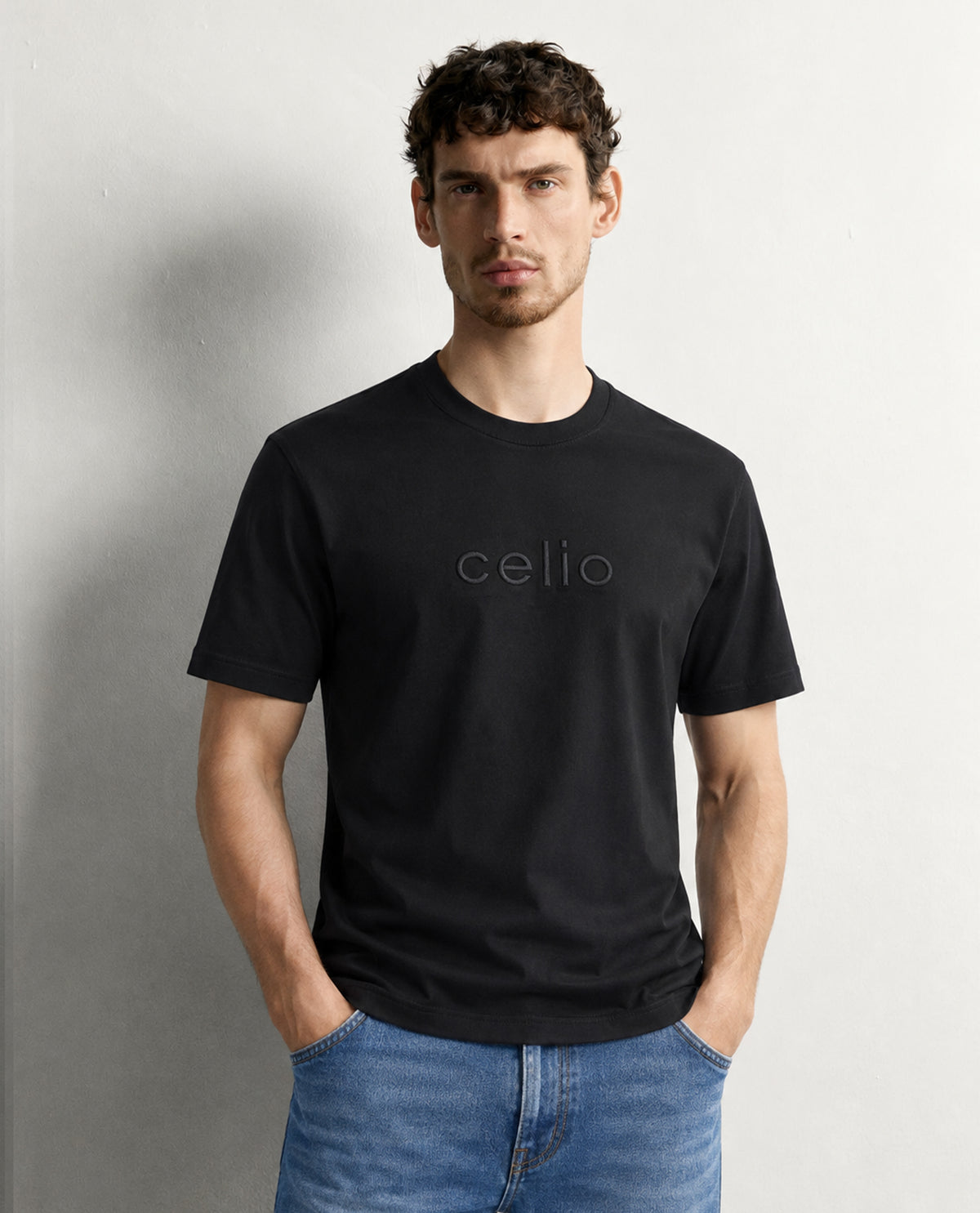 Black colour t shirt featuring round design neck, elegant Design body with a text, Half sleeve.